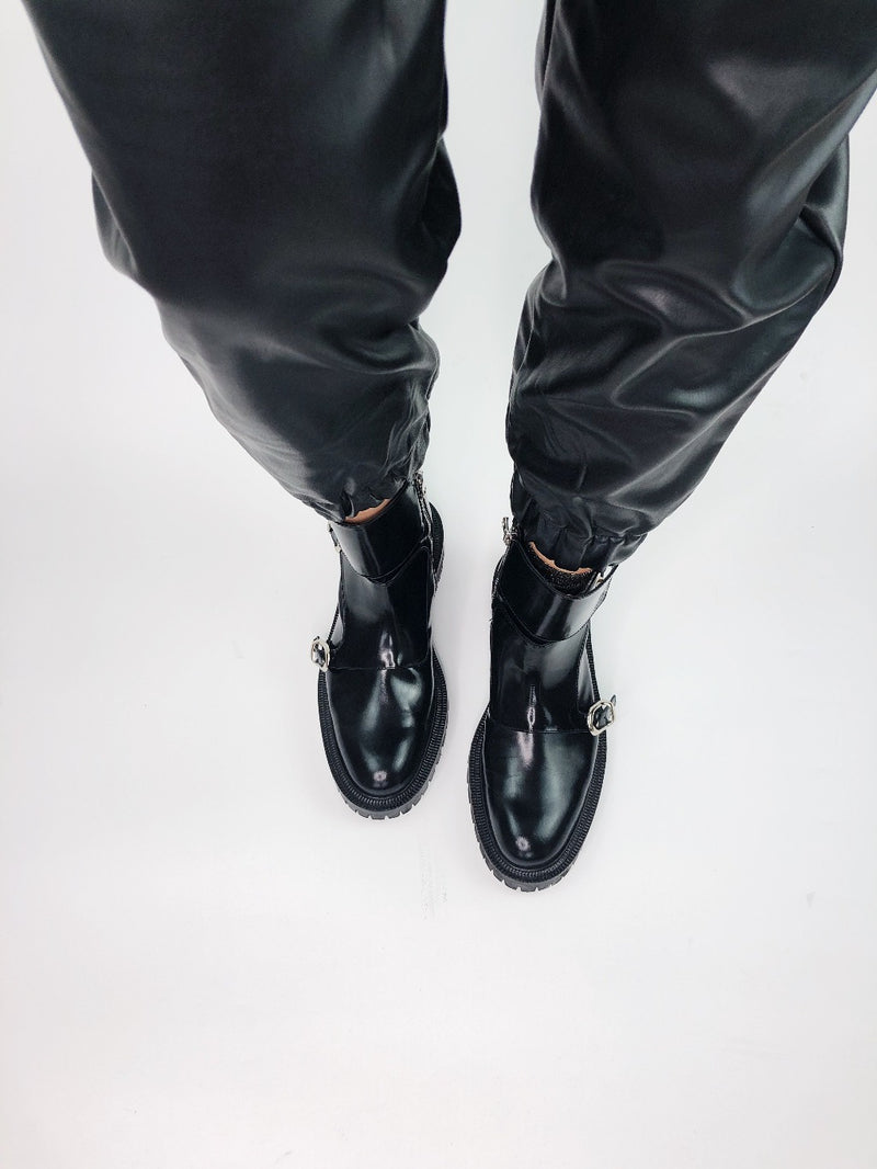 Monk Boots in black glossed leather on a ridged rubber sole