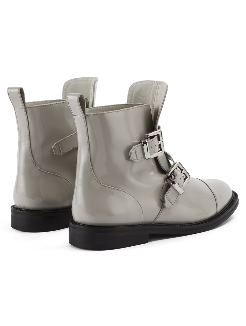 Back view of CWEN ankle glossed leather light grey boots, with two straps, two silver buckles, light tan colour lining and a leather sole