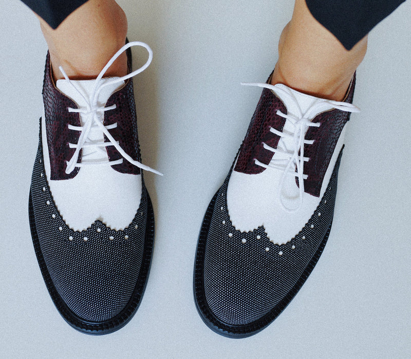 Two feet in CWEN lace up brogue shoe in burgundy snake, white, black&white leather