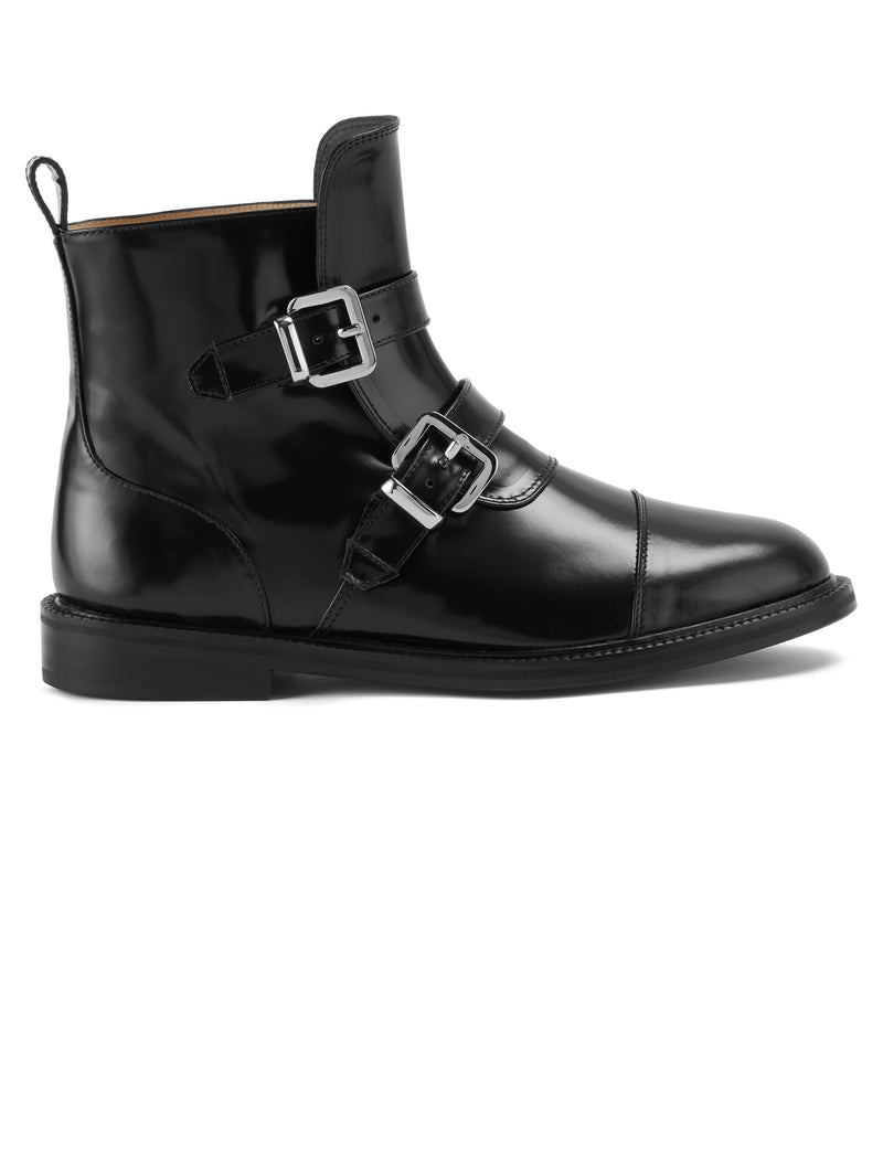 Side view of CWEN ankle glossed leather black boots, with two straps, two silver buckles, light tan colour lining and a leather sole
