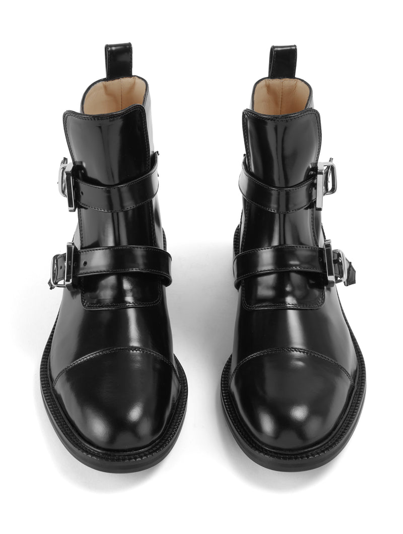 Front view of CWEN ankle glossed leather black boots, with two straps, two silver buckles, light tan colour lining and a leather sole