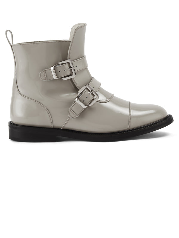 Side view of CWEN ankle glossed leather light grey boots, with two straps, two silver buckles, light tan colour lining and a leather sole
