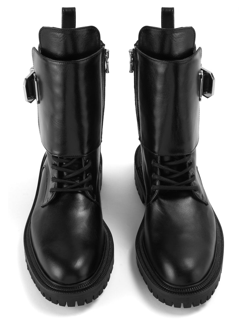 Front view of CWEN black soft leather combat boot, with light tan colour lining, silver buckle and a ridged rubber sole.