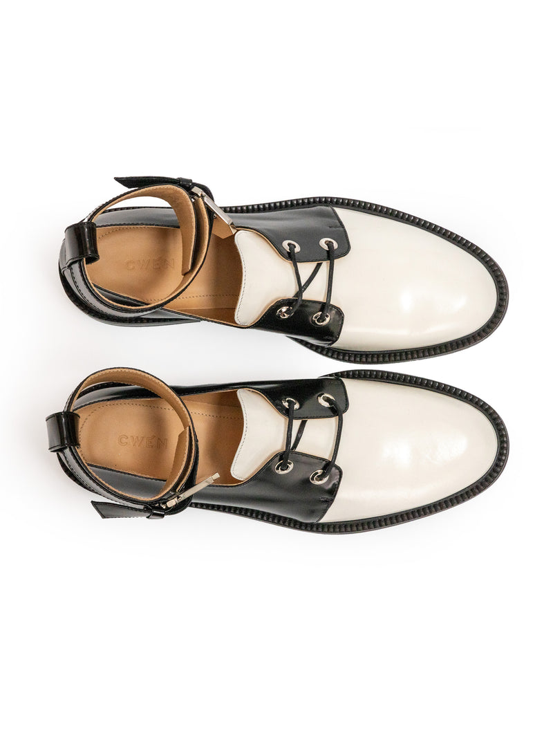 CWEN lace up shoes in black and white glossed leather, with detachable ankle strap and large silver buckle side view